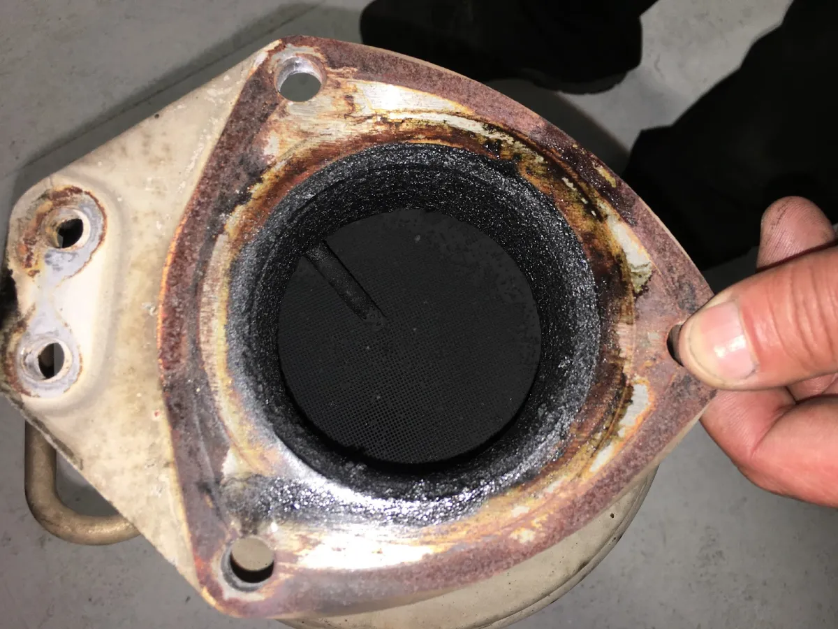 Blocked Mini DPF clogged with soot before cleaning