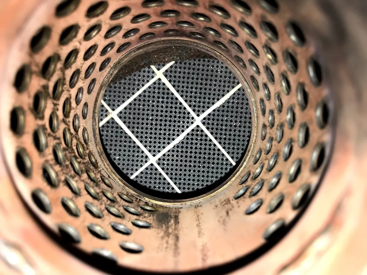 Close-up of clean DPF honeycomb cells letting light through